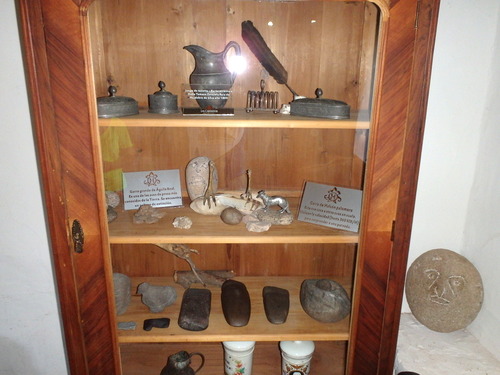 Family heirlooms and ancient native stone implements on display.
